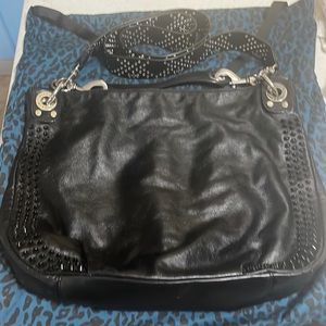 Leather Rebecca Minkoff bag with studded guitar strap.